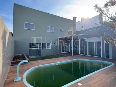 Foto Casa com 4 Dormitórios