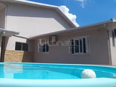 Foto Casa com 4 Dormitórios