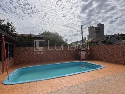 Foto Casa com 6 Dormitórios