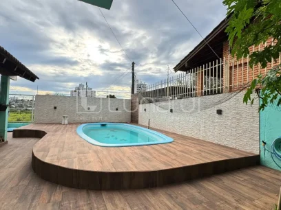 Casa com 4 Dormitórios - Miniatura - Lunardi Imóveis