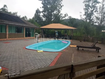 Casa com 4 Dormitórios - Miniatura - Lunardi Imóveis