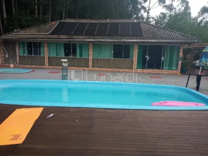 Casa com 4 Dormitórios - Miniatura - Lunardi Imóveis