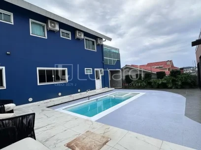 Casa com 4 Dormitórios - Miniatura - Lunardi Imóveis