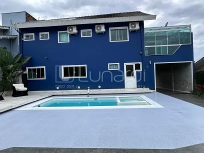 Casa com 4 Dormitórios - Miniatura - Lunardi Imóveis